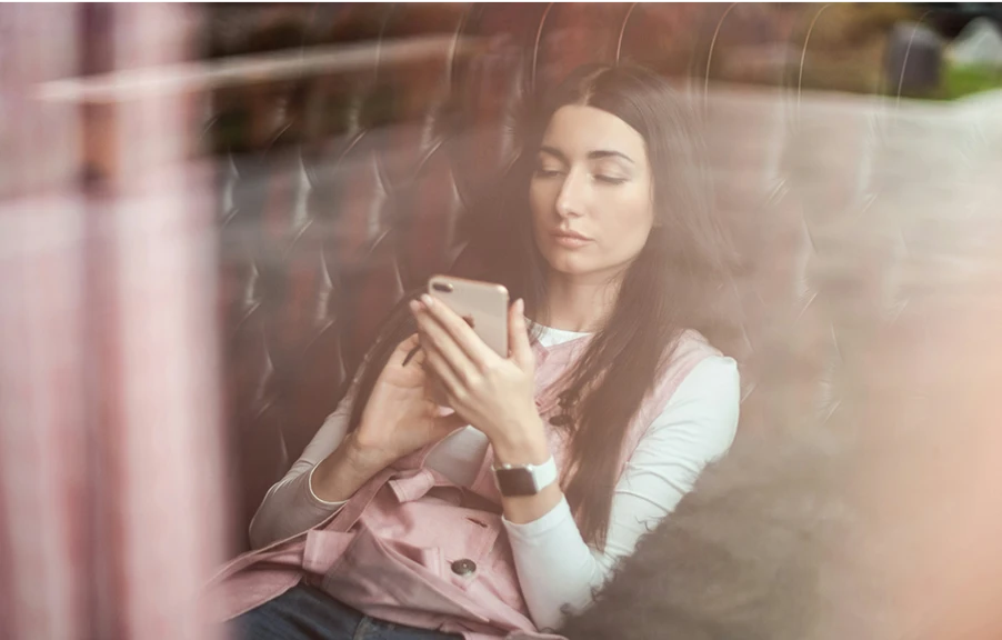 college student looking at her phone