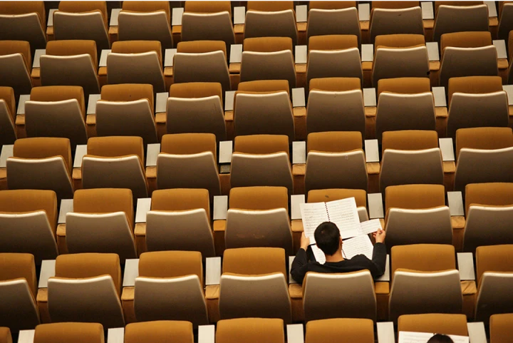 therapy for college students sitting alone in a lecture hall
