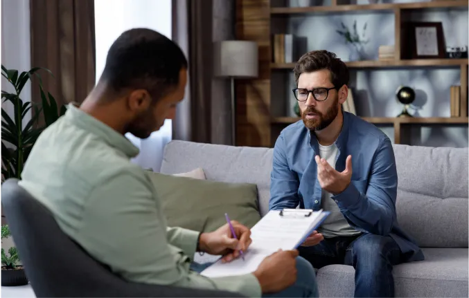 therapy session between two men at Evolve Counseling in Fort Collins