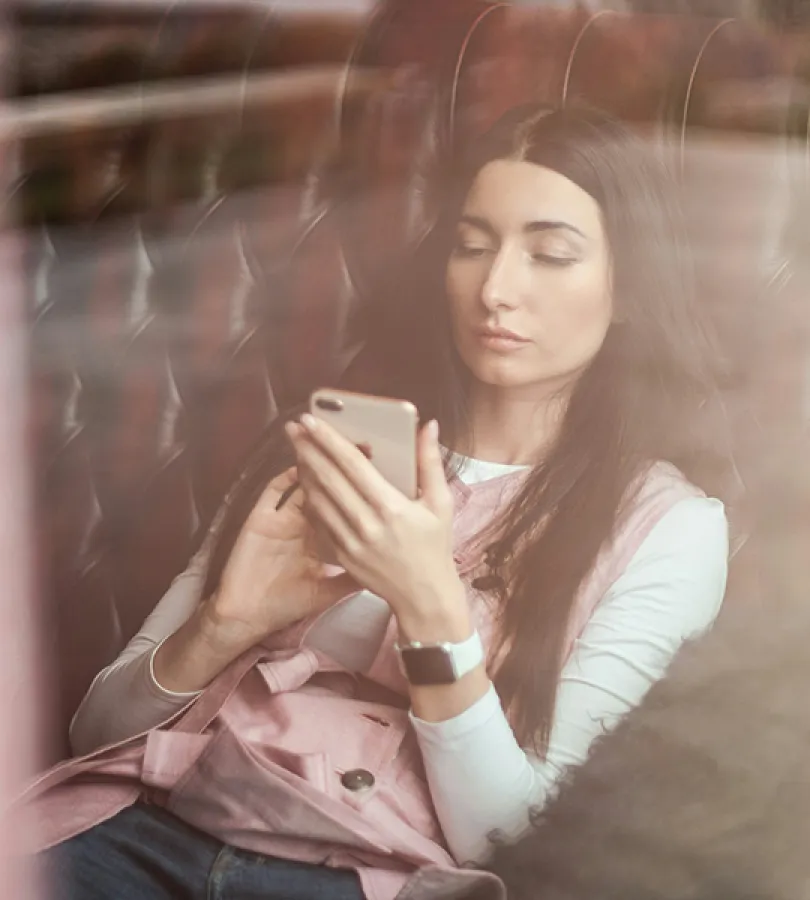 college student looking at her phone